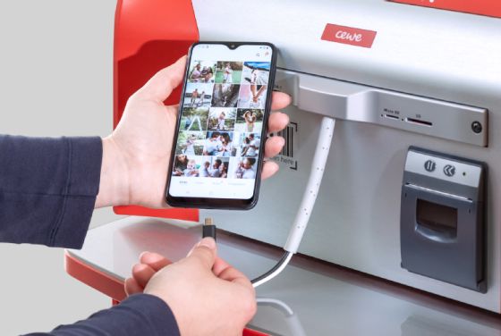 Connecting a smart phone to a instant print Photo Station at Boots.